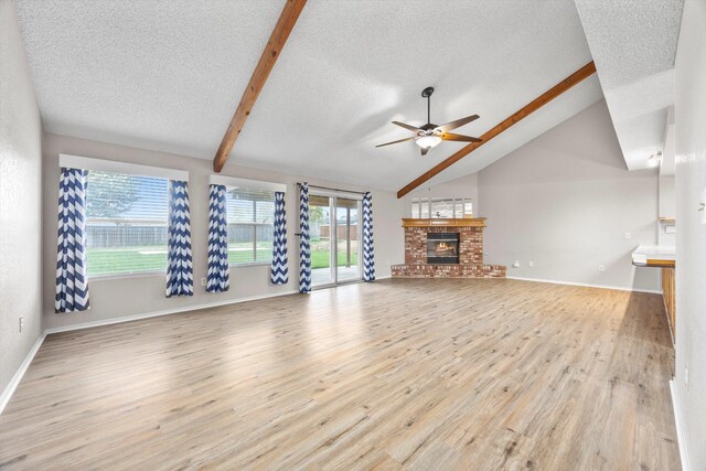 1086 Hickory Ave, Tehachapi, CA 93561 - unfurnished living room featuring wood finished floors, a textured ceiling, a ceiling fan, and lofted ceiling with beams