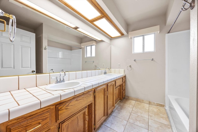 1086 Hickory Ave, Tehachapi, CA 93561 - full bath with baseboards, tile patterned floors, a sink, and double vanity