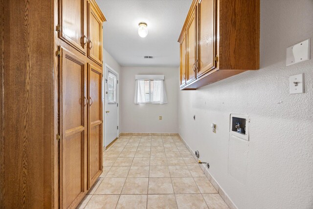 1086 Hickory Ave, Tehachapi, CA 93561 - washroom featuring visible vents, gas dryer hookup, electric dryer hookup, cabinet space, and washer hookup