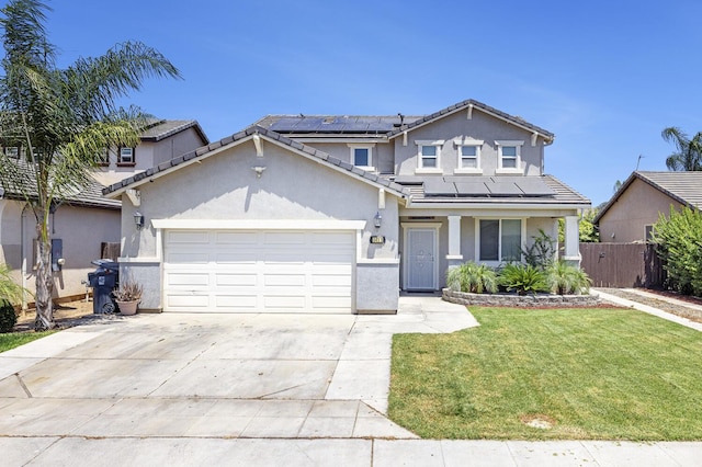1413 La Quinta Way, Madera, CA 93638 - traditional-style house with an attached garage, roof mounted solar panels, stucco siding, and concrete driveway