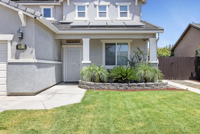 1413 La Quinta Way, Madera, CA 93638 - view of front of property with stucco siding, solar panels, a tile roof, and a porch