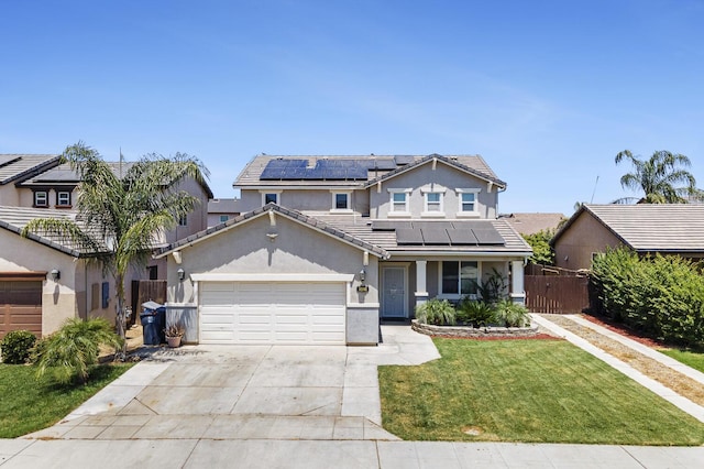 1413 La Quinta Way, Madera, CA 93638 - traditional-style house with roof mounted solar panels, driveway, an attached garage, stucco siding, and a tile roof