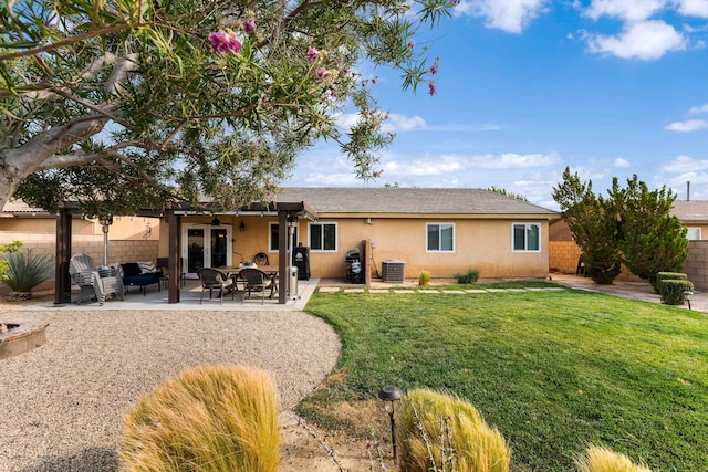 back of house featuring central AC unit, a lawn, french doors, and a patio area