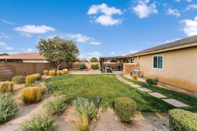 view of yard featuring a patio and central air condition unit