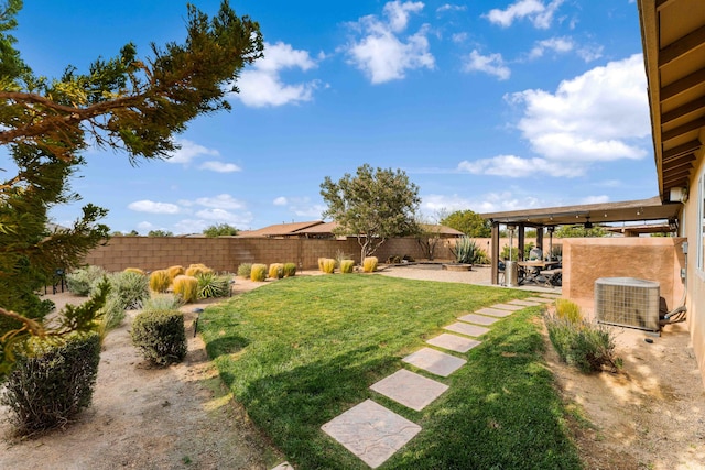 view of yard with a patio area and central air condition unit