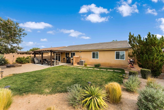 rear view of property with central AC, a yard, and a patio