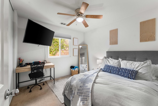 carpeted bedroom with ceiling fan