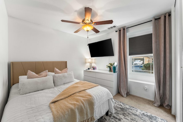 carpeted bedroom featuring ceiling fan