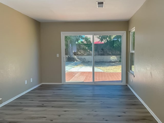 doorway with dark hardwood / wood-style flooring