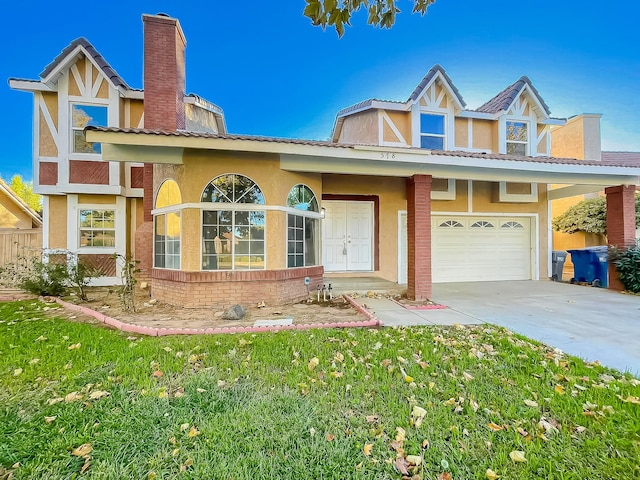 view of front facade featuring a front yard and a garage