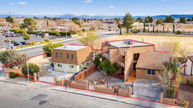 drone / aerial view with a mountain view and a residential view