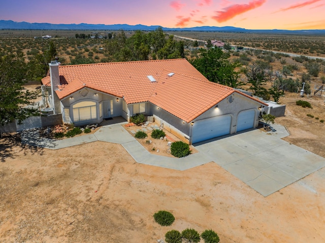 birds eye view of property with a mountain view