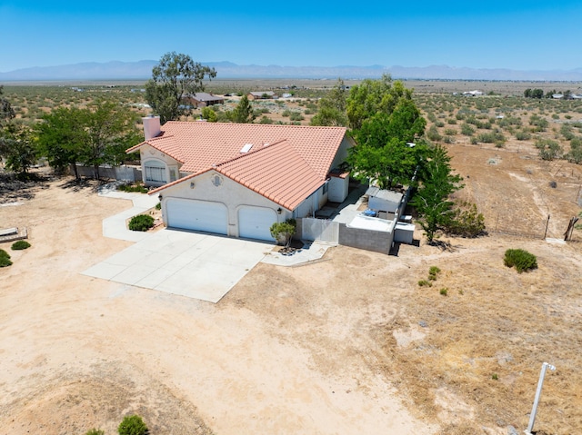 bird's eye view featuring a mountain view and view of desert