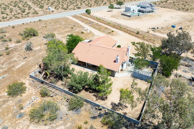 birds eye view of property with a desert view and a rural view