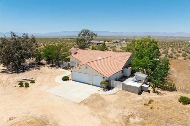 drone / aerial view with a desert view and a mountain view