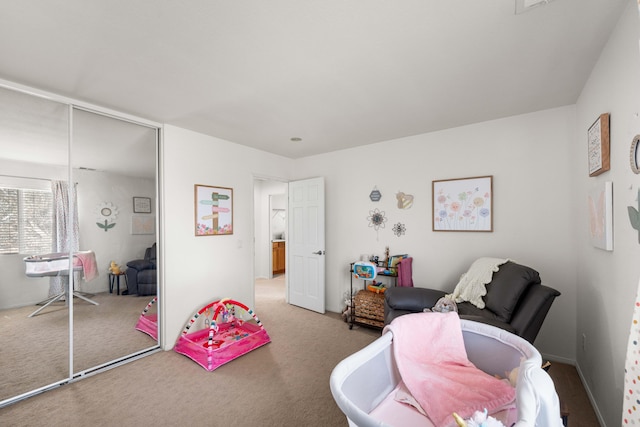 carpeted bedroom featuring a closet