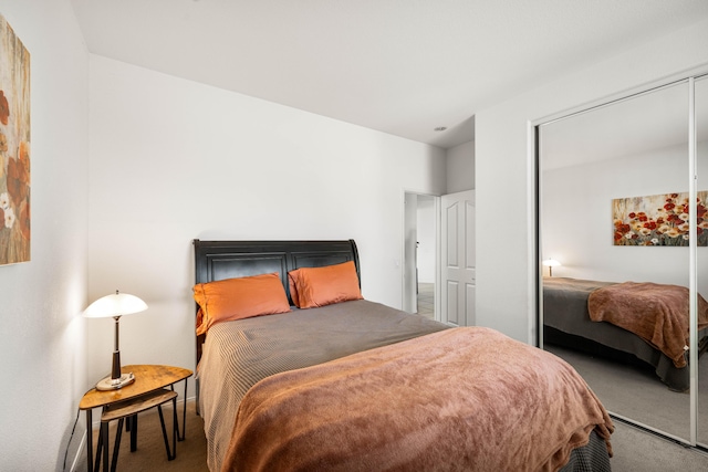 bedroom featuring a closet and carpet flooring