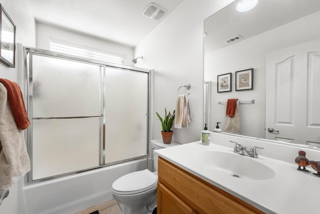 full bathroom with vanity, shower / bath combination with glass door, and toilet