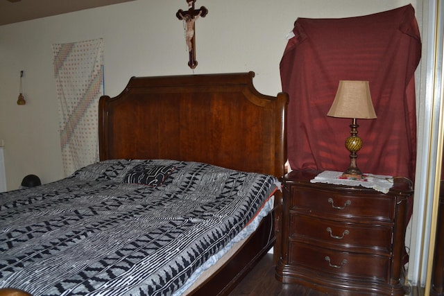 bedroom featuring dark hardwood / wood-style flooring