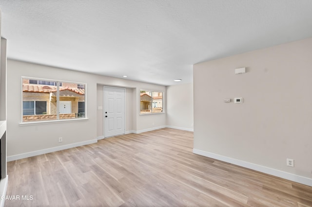 43441 W 30th St Unit 3, Lancaster, CA 93536 - unfurnished living room with wood finished floors and recessed lighting