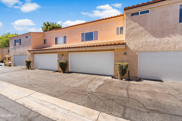 43441 W 30th St Unit 3, Lancaster, CA 93536 - view of front of home featuring stucco siding and a tile roof
