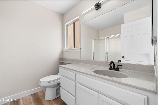 43441 W 30th St Unit 3, Lancaster, CA 93536 - bathroom with vanity, a shower with shower door, and wood finished floors