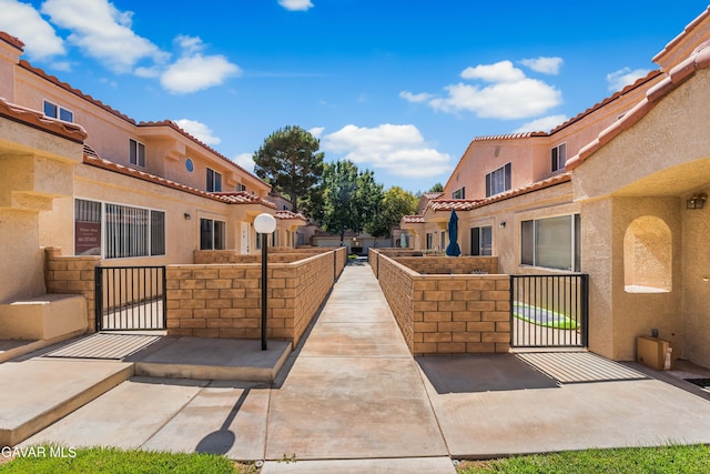 43441 W 30th St Unit 3, Lancaster, CA 93536 - view of property's community with a gate and a residential view