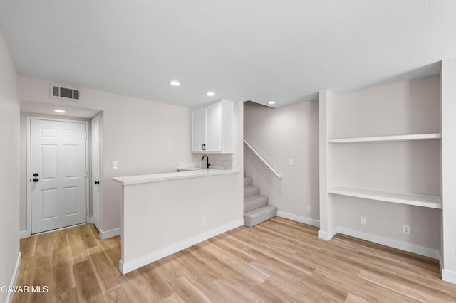 43441 W 30th St Unit 3, Lancaster, CA 93536 - basement featuring light wood-style flooring, recessed lighting, and stairs