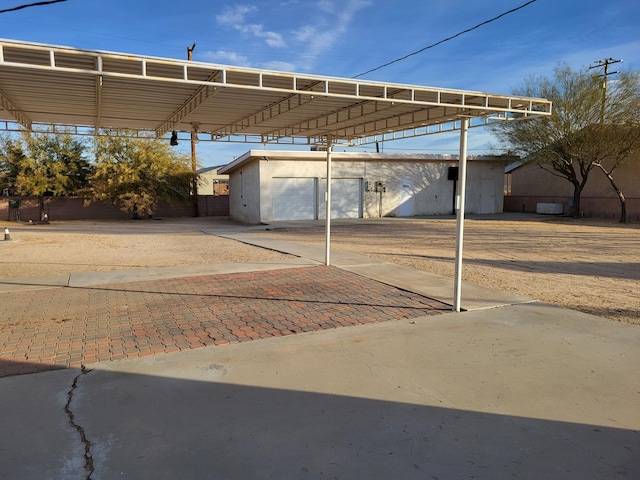 view of vehicle parking with a carport