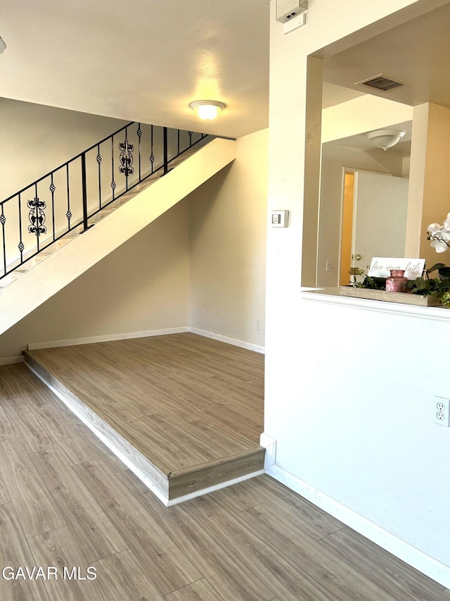 38710 E 10th St Unit 12, Palmdale, CA 93550 - stairway with wood finished floors and baseboards