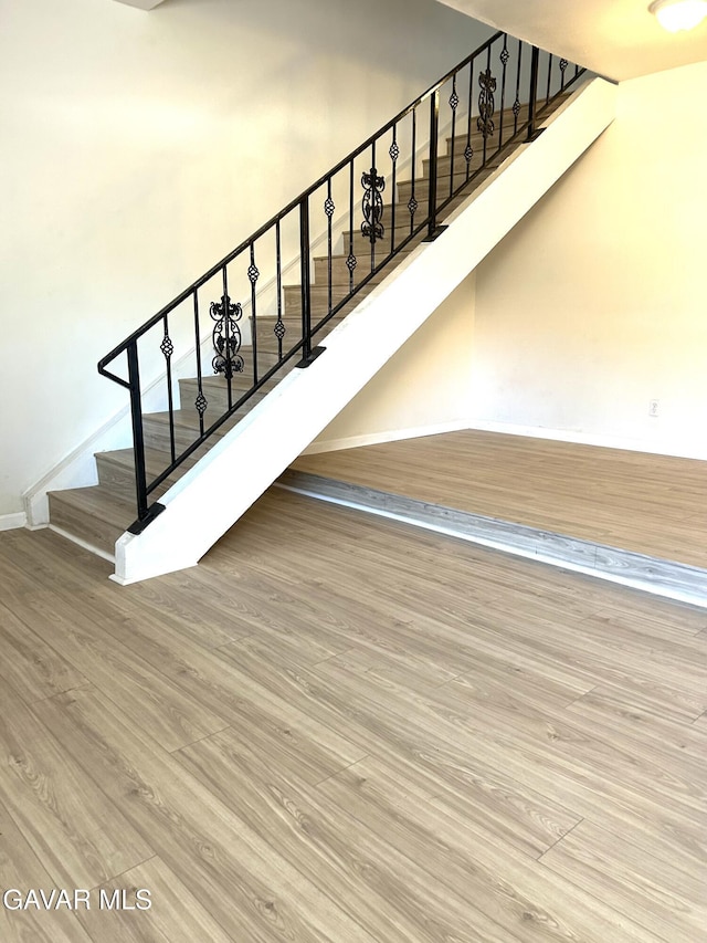 38710 E 10th St Unit 12, Palmdale, CA 93550 - stairway with wood finished floors