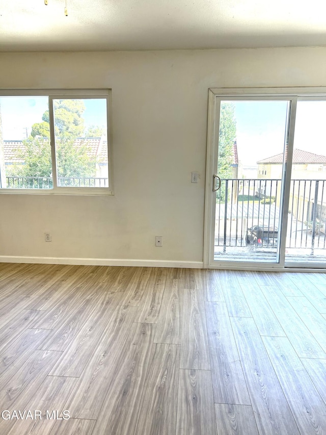 38710 E 10th St Unit 12, Palmdale, CA 93550 - unfurnished living room featuring wood finished floors