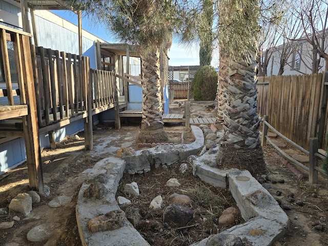 view of yard featuring a wooden deck