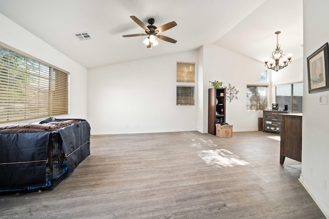 2908 Owens Way, Rosamond, CA 93560 - living area with lofted ceiling, a chandelier, wood finished floors, a ceiling fan, and baseboards