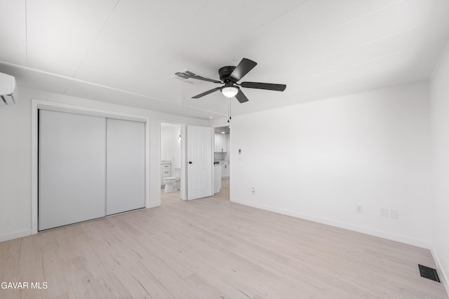 2465 W 55th St, Rosamond, CA 93560 - unfurnished bedroom featuring light wood finished floors, a closet, ensuite bathroom, and ceiling fan