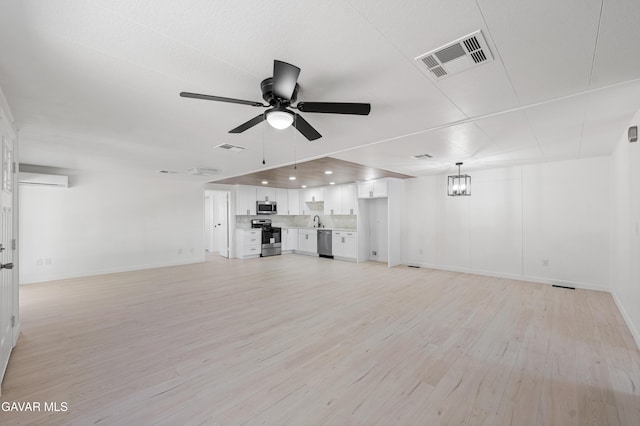 2465 W 55th St, Rosamond, CA 93560 - unfurnished living room with ceiling fan, light wood finished floors, and recessed lighting