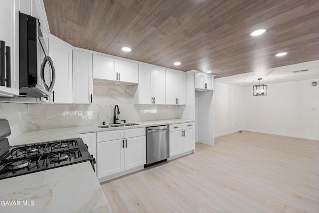 2465 W 55th St, Rosamond, CA 93560 - kitchen featuring stainless steel appliances, wood ceiling, light stone countertops, white cabinets, and light wood-style floors