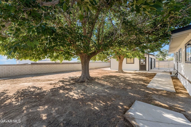 2465 W 55th St, Rosamond, CA 93560 - fenced backyard featuring an outdoor structure