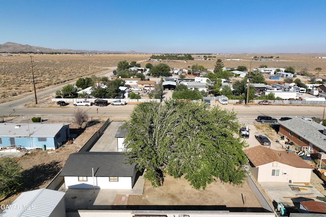 2465 W 55th St, Rosamond, CA 93560 - aerial view of residential area featuring a mountain backdrop and a desert landscape