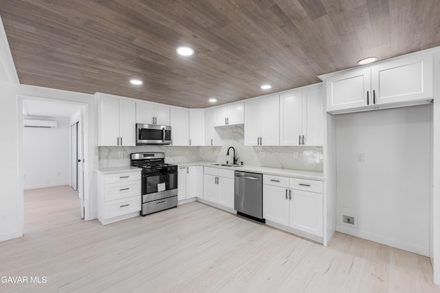 2465 W 55th St, Rosamond, CA 93560 - kitchen featuring stainless steel appliances, light countertops, white cabinetry, recessed lighting, and wooden ceiling