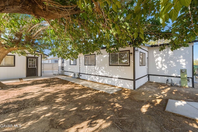 2465 W 55th St, Rosamond, CA 93560 - view of home's exterior featuring a patio area and an outdoor structure