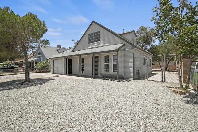 view of front of property with covered porch and a garage