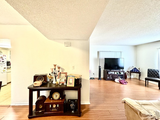 44200 Kingtree Ave Unit 6, Lancaster, CA 93534 - living room with a textured ceiling and wood finished floors