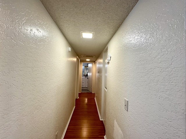 44200 Kingtree Ave Unit 6, Lancaster, CA 93534 - corridor with a textured wall, wood finished floors, and a textured ceiling