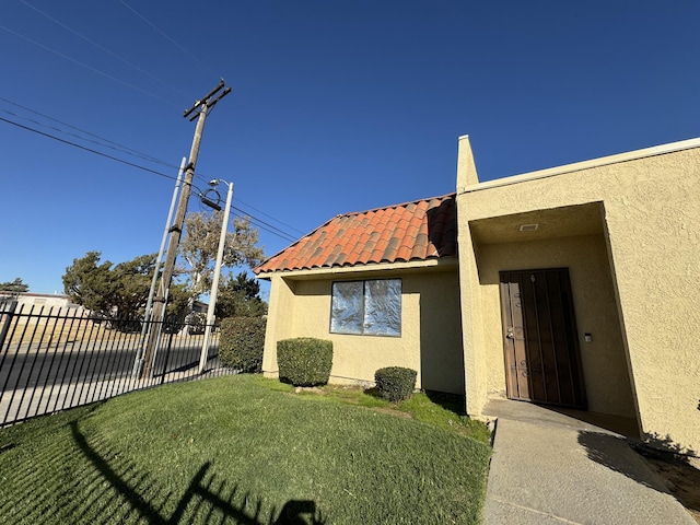 44200 Kingtree Ave Unit 6, Lancaster, CA 93534 - property entrance featuring stucco siding and a tiled roof
