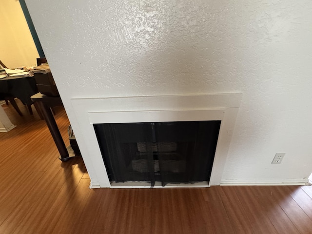 44200 Kingtree Ave Unit 6, Lancaster, CA 93534 - detailed view of a fireplace and wood finished floors