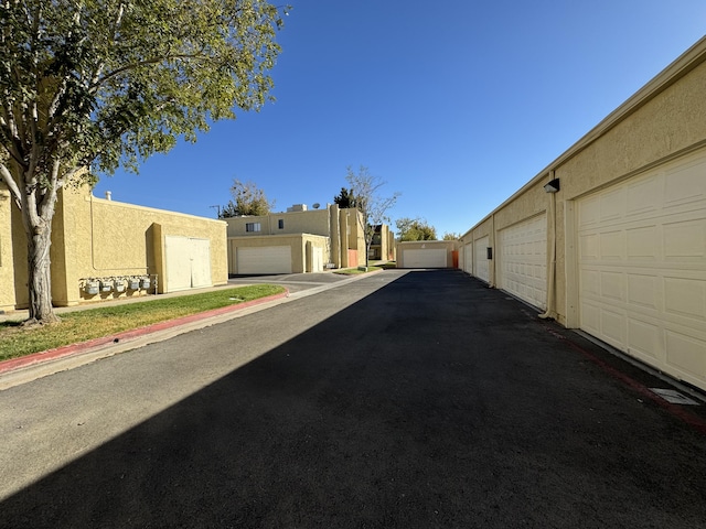 44200 Kingtree Ave Unit 6, Lancaster, CA 93534 - view of asphalt road with community garages