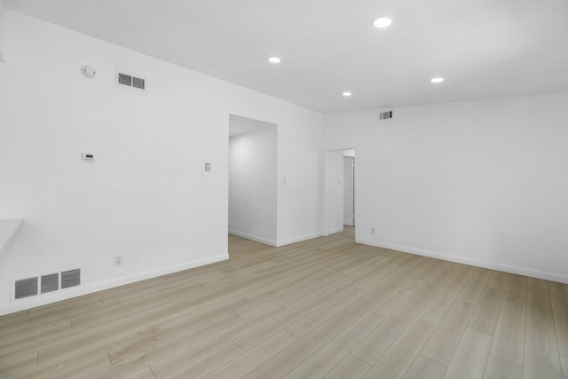 unfurnished room with light hardwood / wood-style floors