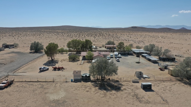 birds eye view of property with a mountain view