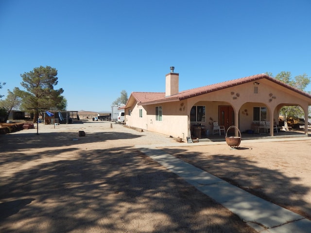 back of property featuring a patio